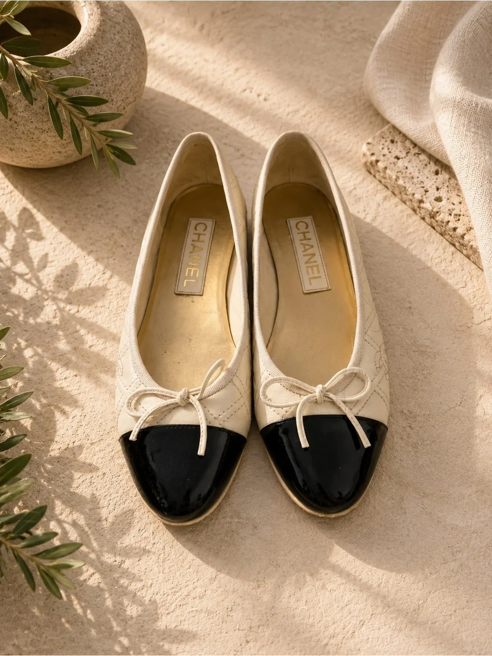 CHANEL Cream Quilted Leather Ballet Flats with Black Patent Cap Toe